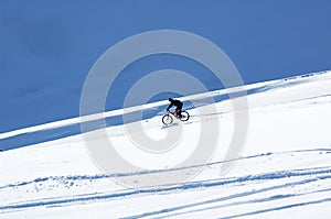 Snow downhill on bike