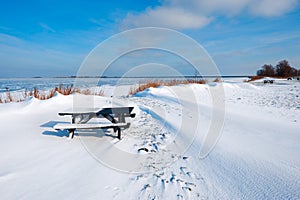 Snow dunes at a lake in Winter