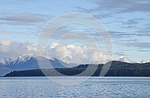 Snow dusted mountains by the sea in Southeast Alaska