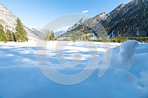 Snow fall early winter and late autumn. Alps landscape with snow capped mountains in the late autumn season.