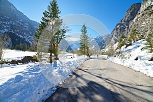 Snow fall early winter and late autumn. Winter road in the forest.