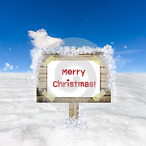 Snow field and blue sky with wooden sign board