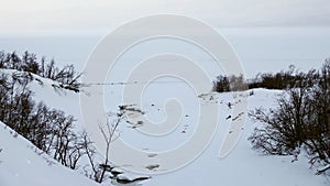 Snow field and frozen lake Tornetrask in Abisko National Park in Sweden in winter