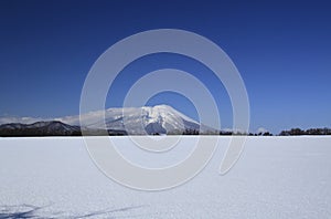 Snow field and Mt.Iwate photo