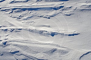Snow fields covered with intricate patterns from the wind, a copy space, close-up.