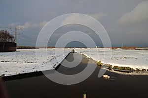 Snow filled meadow in moerkapelle, Netherlands