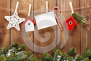 Snow fir tree, photo frame and christmas decor on rope