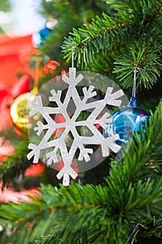 Snow flake and Shatterproof ball ornament on Christmas Tree