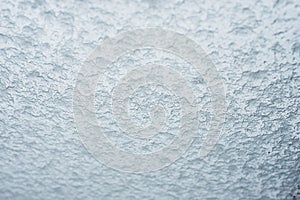 snow flakes on window on grey sky background