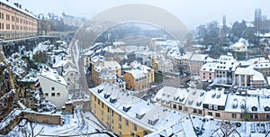 Snow and fog covered Grund, the old part of Luxembourg city panorama