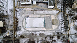 Snow football pitch. Football field top view in the winte