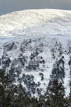 Snow on Geal Charn in the Cairngorms National Park of Scotland