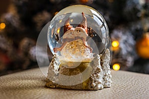Snow globe on festive background Xmas concept snowman