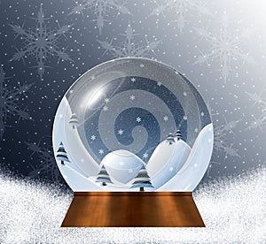 Snow globe with miniature winter landscape scene inside