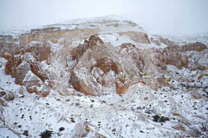 Snow gloomy day in the mountains of Cappadocia. Vicinities of Goreme, Turkey