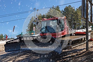 Snow goomer waiting near the ski slope in Spain