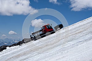 Snow grooming machine climbing on Elbrus glacier