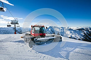 Snow-grooming machine on snow hill