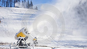 Snow gun in the mountains. panorama.