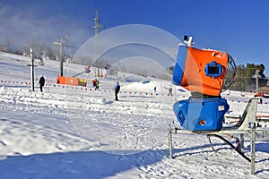 Snow-gun working on a ski slope.Working snowgun in the photo.