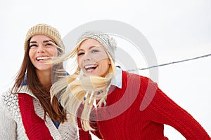 Snow, happy and funny with lesbian couple outdoor in winter on romantic vacation, adventure or holiday. Love, smile and