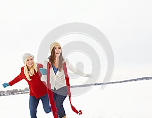 Snow, happy and lesbian girl friends outdoor in winter on romantic vacation, adventure or holiday. Love, smile and queer