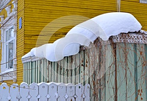 Snow hat on the fence