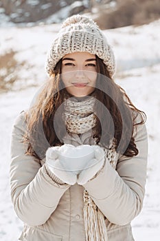 Snow Heart in Hands of a Woman