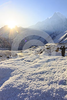 Snow and Himalaya Machapuchare mountain with sunrise, at Annapurna base camp, Nepal