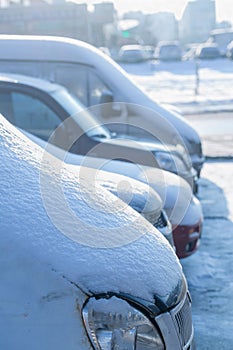 Snow on the hood of cars