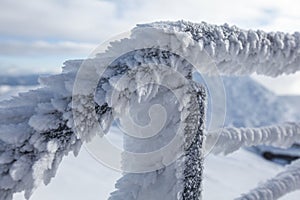 Snow and ice covered stairs fence illustrating extreme cold