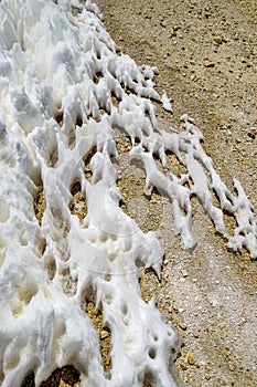 Snow and ice formations form patterns on the ground, in the high altitude puna desert near Salta, Argentina