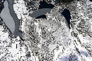 Snow and ice on Marcio lake, Orobie, italy