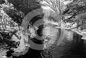 Snow and ice at a Muskoka River in black and white