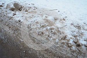 Snow, ice, slush and winter mud at a pedestrian crossing. The air temperature is about 0. Difficult driving conditions