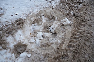 Snow, ice, slush and winter mud at a pedestrian crossing. The air temperature is about 0. Difficult driving conditions