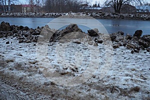 Snow, ice, slush and winter mud at a pedestrian crossing. The air temperature is about 0. Difficult driving conditions