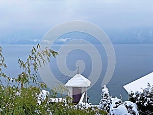 Snow idyll on the lake Lucerne VierwaldstÃ¤ttersee or Vierwaldstaettersee in the Weggis settlement - Canton of Lucerne
