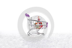 Snow on iÃÂ§inde Christmas water globe with Santa Claus shopping cart, on white background. photo