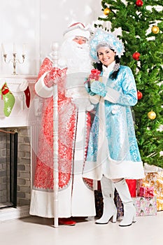 Snow maiden and santa claus