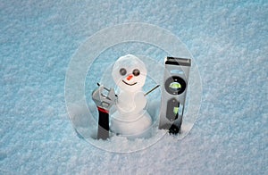 Snow man. Repairman with repair tools. Support repair and recover service. Snowman isolated on snow background.