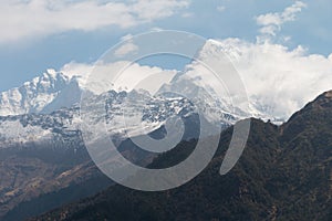 Snow mountain with blue sky and clouds