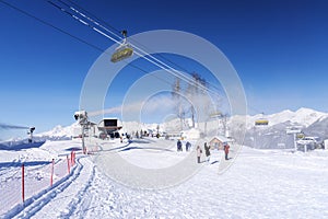 Snow mountain glade with ski lifts