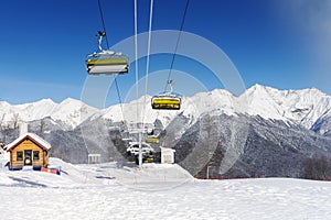 Snow mountain glade with ski lifts