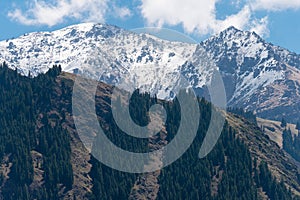 Snow Mountain in Heavenly Lake of Tianshan (Tianchi) in Fukang, Changji, Xinjiang, China. It is part of UNESCO World