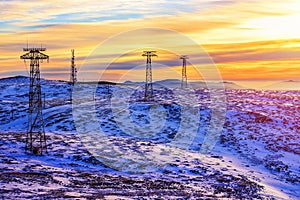 Snow mountain landscape and electric poles