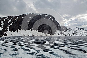 snow mountain landscape beside road in norway