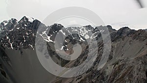 Snow mountain panorama view from helicopter window in New Zealand.