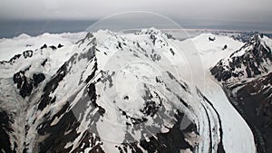 Snow mountain panorama view from helicopter window in New Zealand.