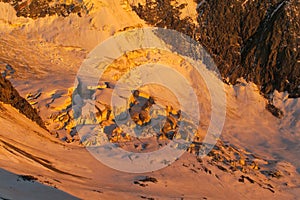 Snow mountain ridge in Alps at sunset